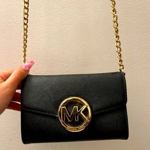 Black and gold Michael Kors crossbody